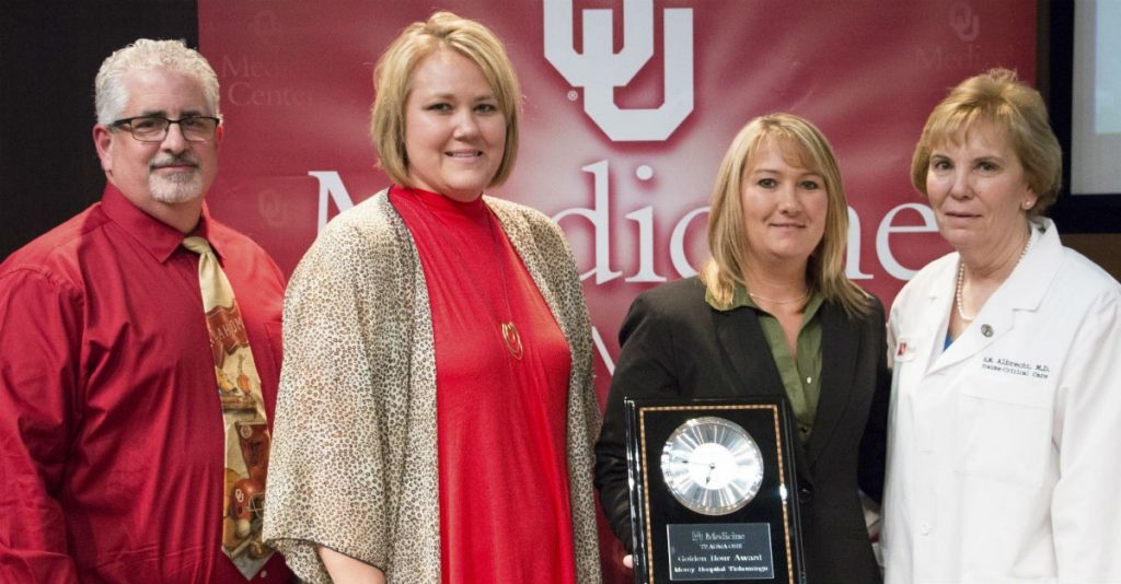 Mercy Hospital Tishomingo co-workers Steve Saltiel, Jennifer Imotichey and Ashley Smalling (pictured left to right with OU Medical Center's Dr. R.M. Albrecht) accepting the "Golden Hour" Award.