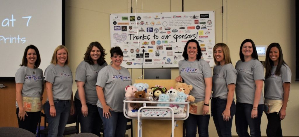 Mercy HeartPrints volunteer support group - left to right - Kristen Milsark, Liz Burke, Amanda Black, Kelly Sander, Jane DeLong, Nora LaFata, Sara Merkle, and Jen Johnson. 
