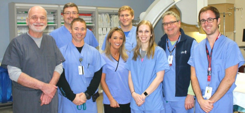 Dr. Nolewajka, left, with cardiology team members and Medtronic representatives.
