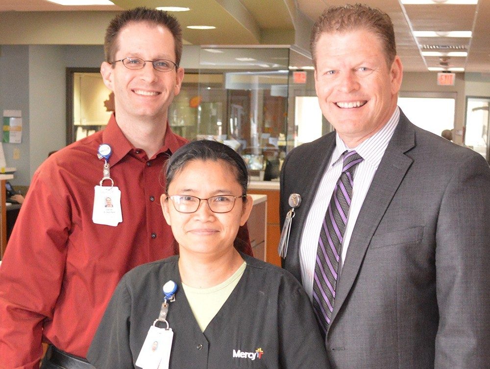 Vice President of Finance Dan Eckenfels and President Eric Ammons presented Patty Wiseman with her Sunshine Award.