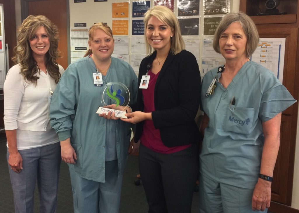 Part of the team from Mercy Clinic Eye Specialists - Ophthalmology accepts the Saving Sight Excellence in Eye Donation Award.