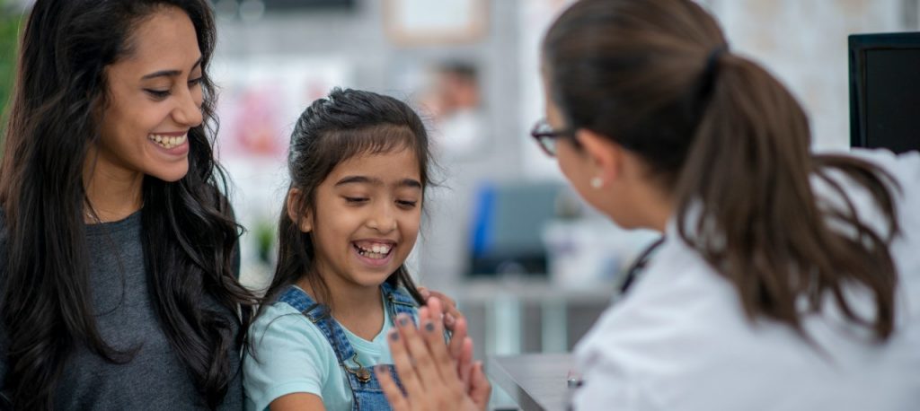 Mother and daughter visiting healthcare provider