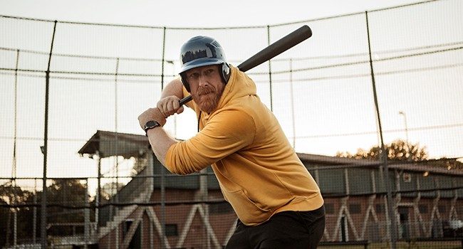 man at home plate batting